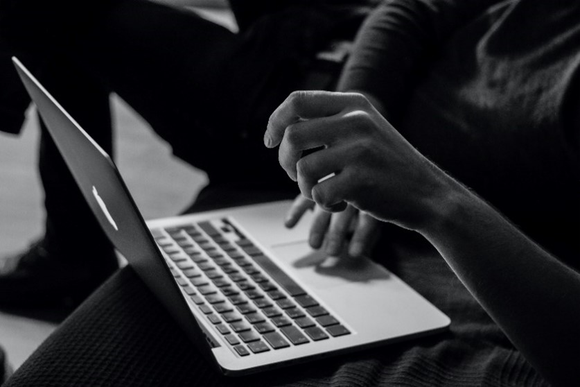 A person typing on a computer